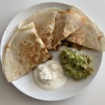 Chicken and bean quesadilla with guacamole and sour cream